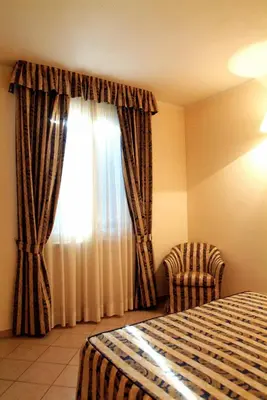 Letto o letti in una camera di Hotel La Maddalena
