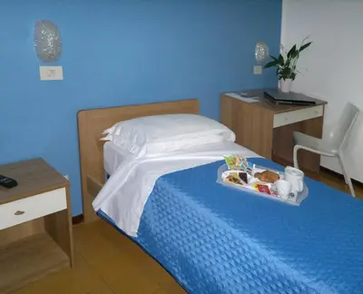 Letto o letti in una camera di Albergo Papillon
