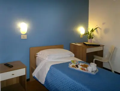 Letto o letti in una camera di Albergo Papillon