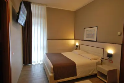 Letto o letti in una camera di Hotel Lenotel