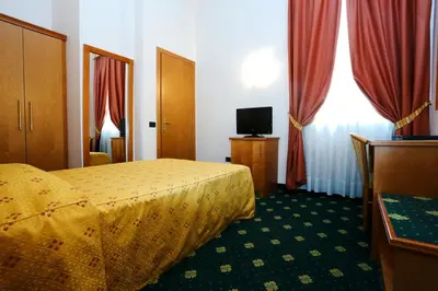Letto o letti in una camera di Hotel Estense