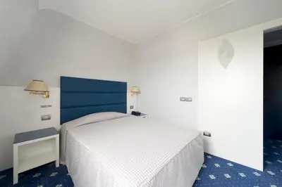 Letto o letti in una camera di Hotel Estense
