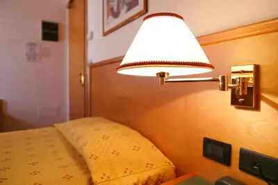 Letto o letti in una camera di Hotel Estense