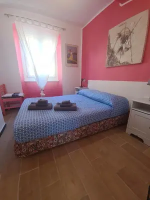 Letto o letti in una camera di Rosa Tramonto Portofino by PortofinoVacanze