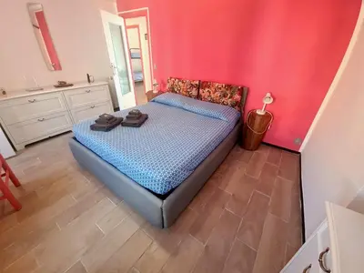 Letto o letti in una camera di Rosa Tramonto Portofino by PortofinoVacanze