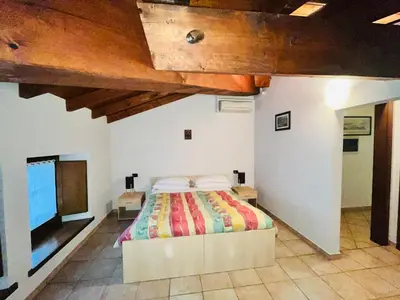 Letto o letti in una camera di Al Cacciatore