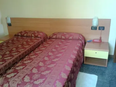 Letto o letti in una camera di Hotel San Geminiano