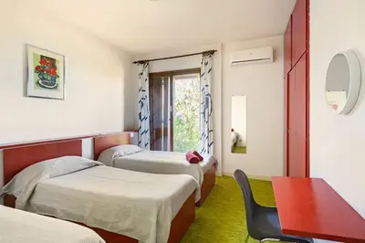 Letto o letti in una camera di Oasi di Mastarone - Il vino e le Rose