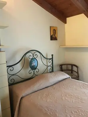 Letto o letti in una camera di B&B Lodi Centro