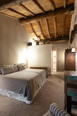 Letto o letti in una camera di Antica Corte Pallavicina Relais