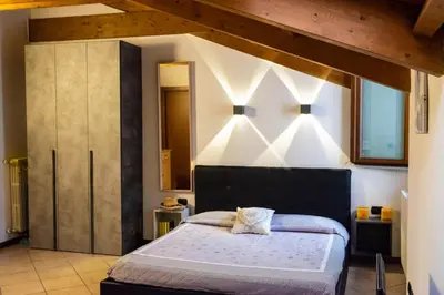 Letto o letti in una camera di Monolocale vicino Milano CIR 00014