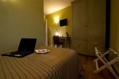 Letto o letti in una camera di Hotel Locanda Stendhal