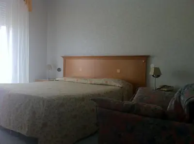 Letto o letti in una camera di Hotel Lido