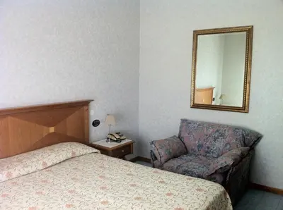Letto o letti in una camera di Hotel Lido