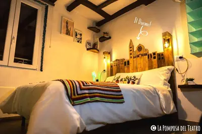 Letto o letti in una camera di La Pomposa del Teatro