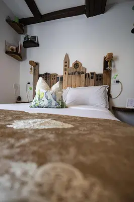 Letto o letti in una camera di La Pomposa del Teatro