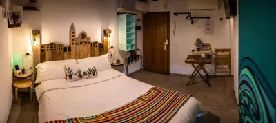 Letto o letti in una camera di La Pomposa del Teatro