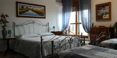 Letto o letti in una camera di B&B Paola e Francesco