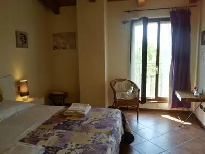 Letto o letti in una camera di Agriturismo La Fattoria Del Boschetto