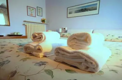 Letto o letti in una camera di Corte Posta B&B - parcheggio e bagno in camera - ideale per Coppie, Soggiorni di lavoro, Viaggiatori interessati a arte e cultura
