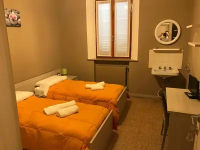 Letto o letti in una camera di Albergo centrale