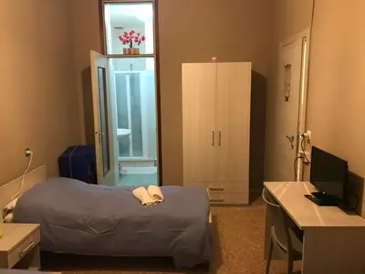 Letto o letti in una camera di Albergo centrale