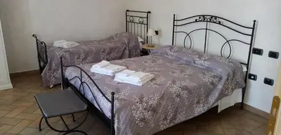 Letto o letti in una camera di B&B Residence il Ciliegio , Via Villa Superiore 93 Luzzara