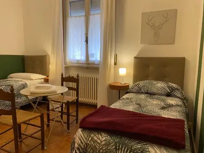 Letto o letti in una camera di Affittacamere Room ospedale Maggiore