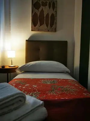 Letto o letti in una camera di Affittacamere Room ospedale Maggiore