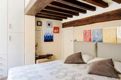 Letto o letti in una camera di PALAZZO CORDERO APARTMENT