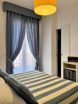 Letto o letti in una camera di Albergo Degli Amici