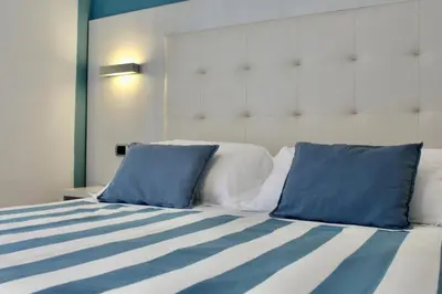 Letto o letti in una camera di Albergo Degli Amici