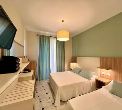 Letto o letti in una camera di Albergo Degli Amici