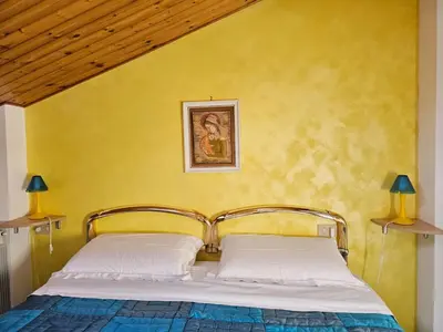Letto o letti in una camera di Mansarda Natalie