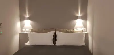 Letto o letti in una camera di Sarzana's Rooms