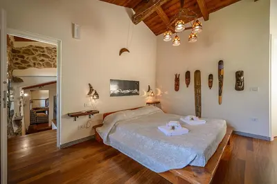 Letto o letti in una camera di L'Occhio di Santa Lucia, Terre Marine
