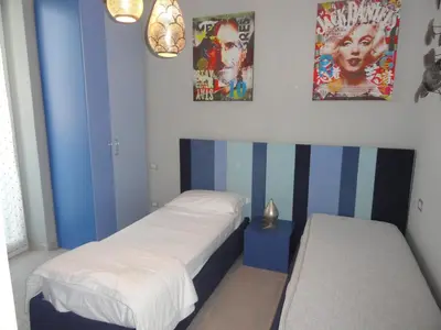 Letto o letti in una camera di Sapore di mare
