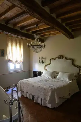Letto o letti in una camera di Villino di Porporano
