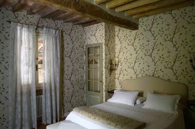 Letto o letti in una camera di Villino di Porporano