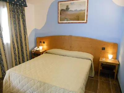 Letto o letti in una camera di Hotel Sonno D'Autore