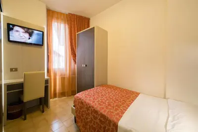 Letto o letti in una camera di Hotel Carancini