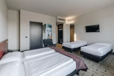 Letto o letti in una camera di Hotel Continental
