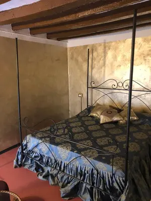 Letto o letti in una camera di Dimora del Podestà