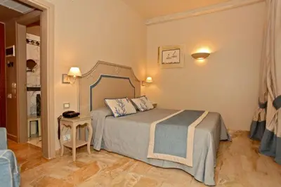 Letto o letti in una camera di Hotel La Colonnina