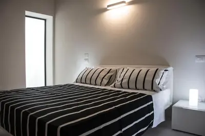 Letto o letti in una camera di Residenza La Torre