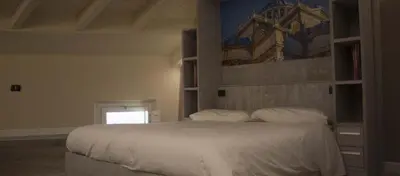 Letto o letti in una camera di Palazzo Domanto Apartments Parma