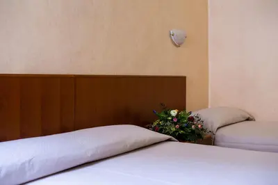 Letto o letti in una camera di Hotel Astor