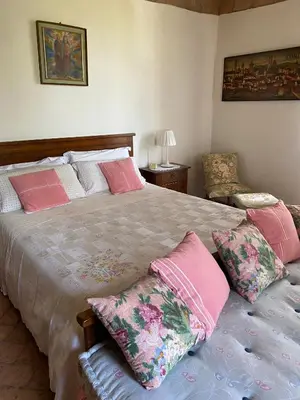 Letto o letti in una camera di Torre Colombaia