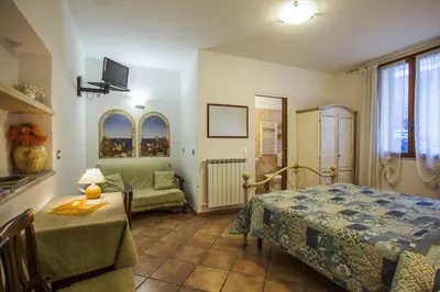 Letto o letti in una camera di Affittacamere Mariella