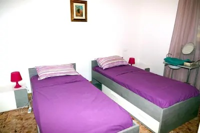 Letto o letti in una camera di NOEMI & JULIENNE